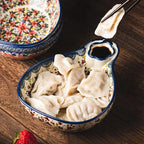 Close-up of hand-painted floral designs on Odriva bowl