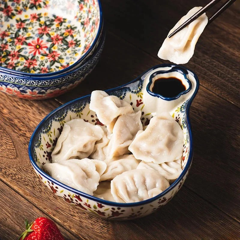 Close-up of hand-painted floral designs on Odriva bowl